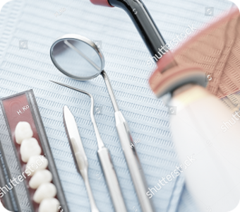 stock-photo-dental-instruments-and-dentures-lying-on-sterile-medical-napkin-in-clinic-closeup-2041986995