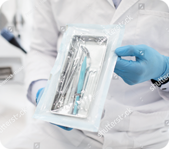 stock-photo-unrecognizable-dentist-doctor-in-uniform-demonstating-sealed-sterilization-pouch-with-clean-dental-2009968658